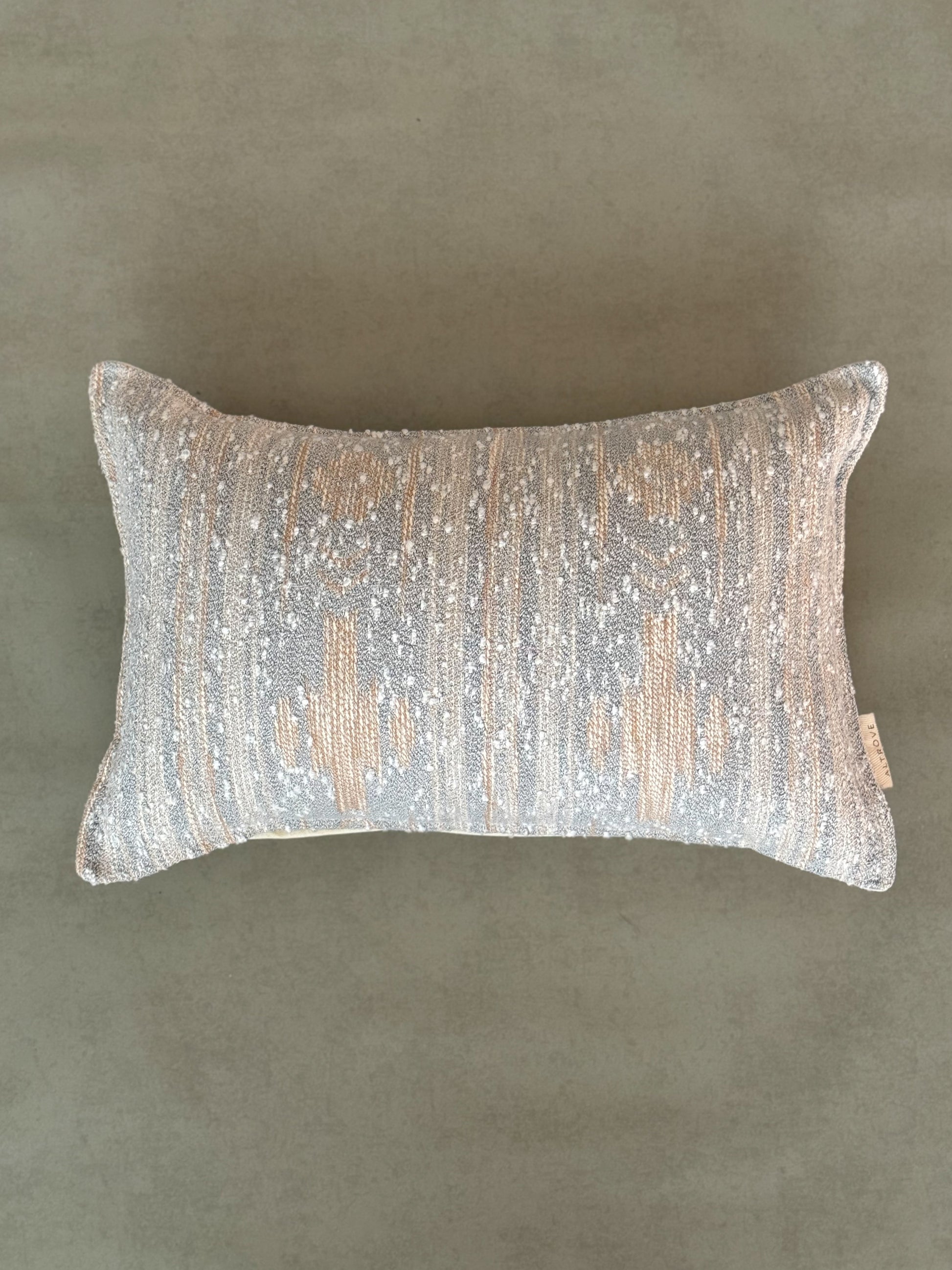 Grey decorative cotton oblong cushion to be styled on sofa,chair or bed.