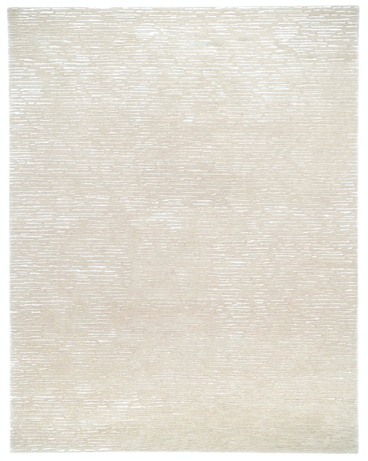 Beige area rug with a subtle pattern on a white background