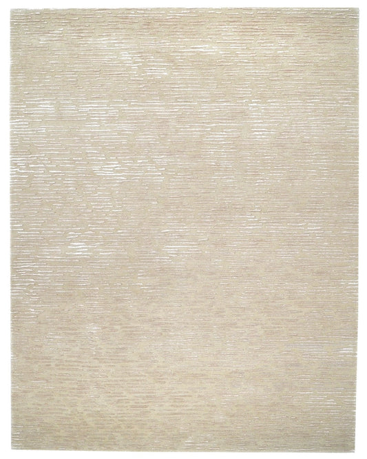 Beige area rug with a subtle pattern on a plain background