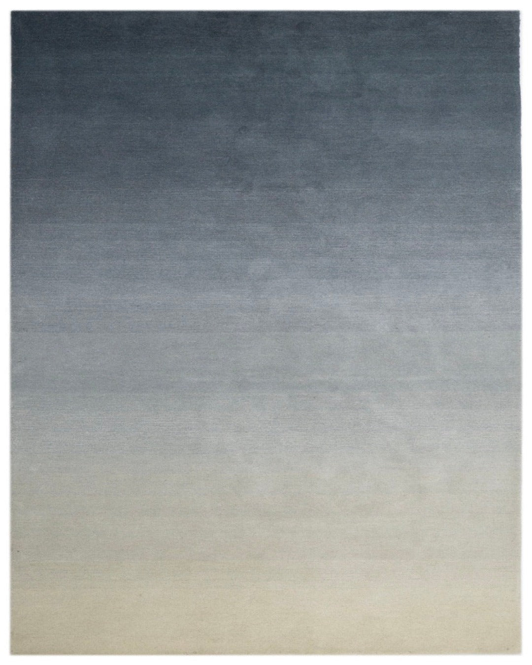 Gradient rug transitioning from dark blue to light gray