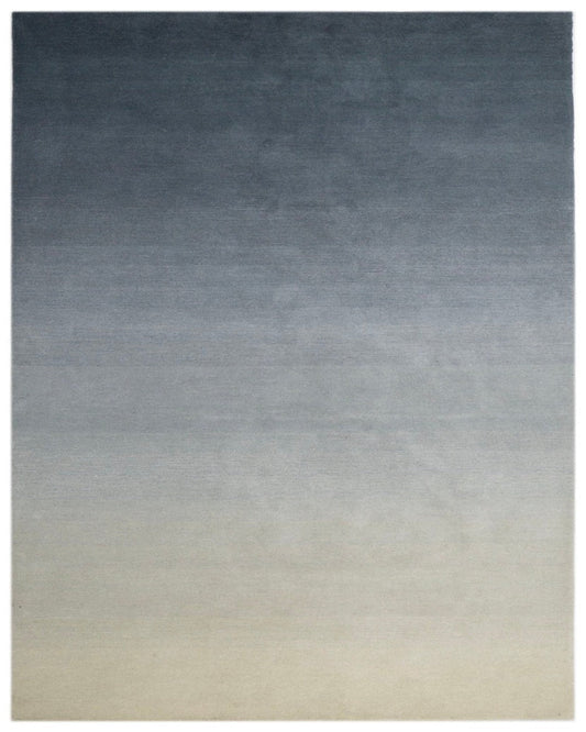 Gradient rug transitioning from dark blue to light gray