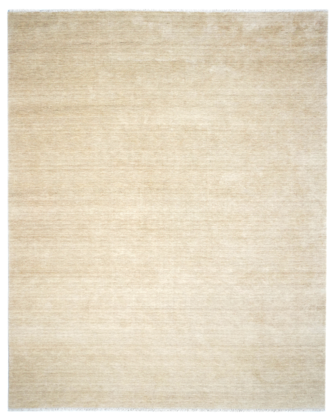 Beige area rug with a subtle pattern on a white background