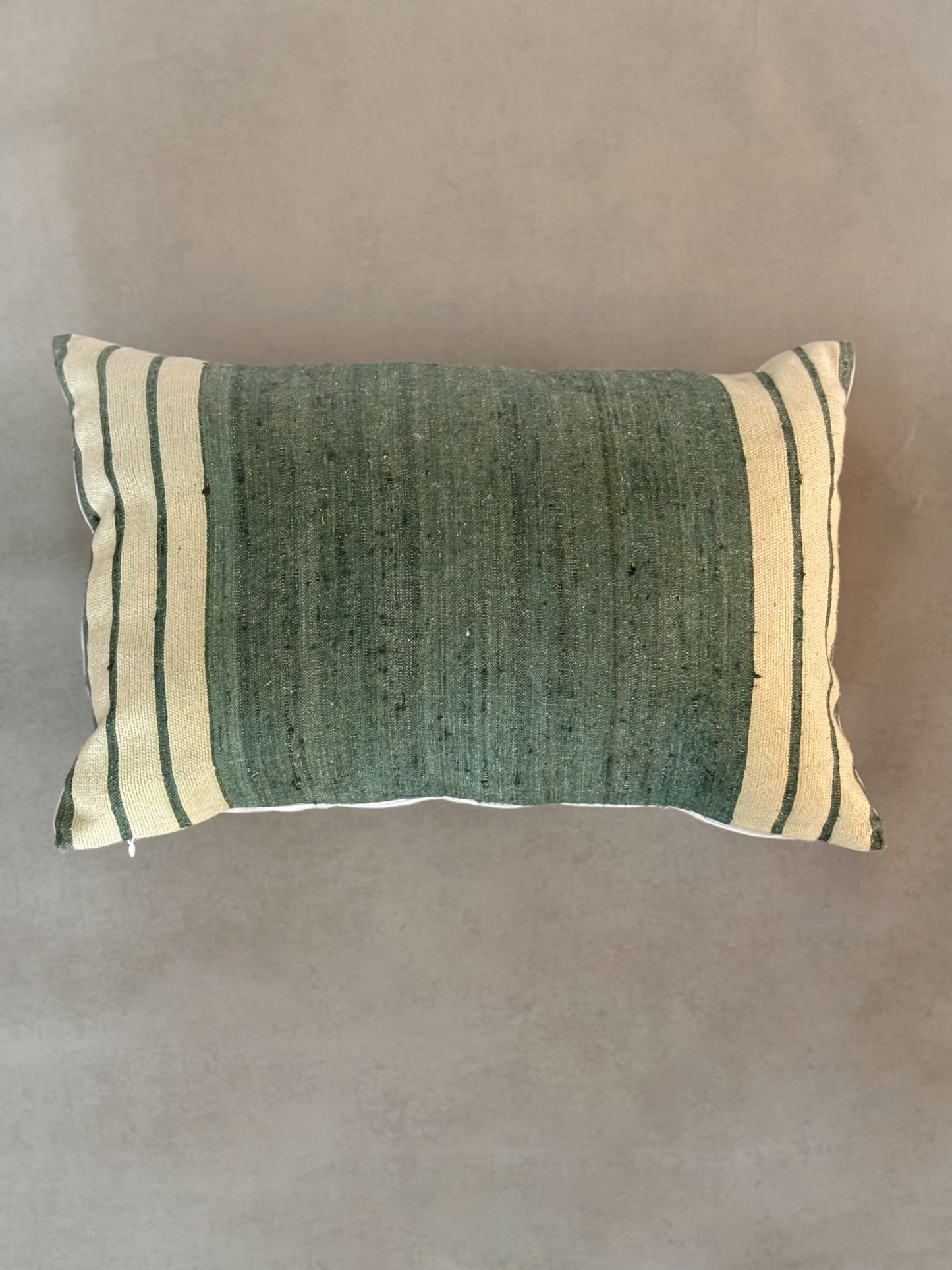 striped pillow on a textured background