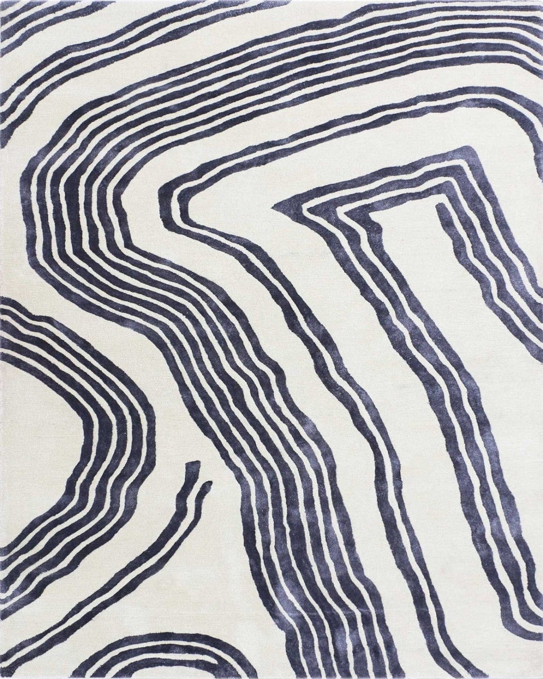 Rug with blue wavy pattern on white background