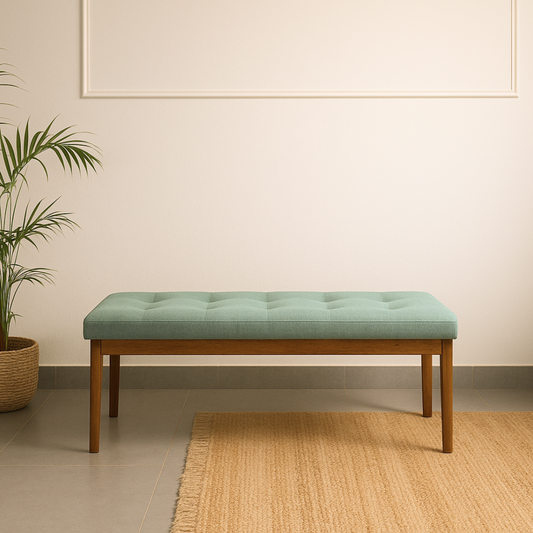 Green upholstered bench with wooden legs in a room