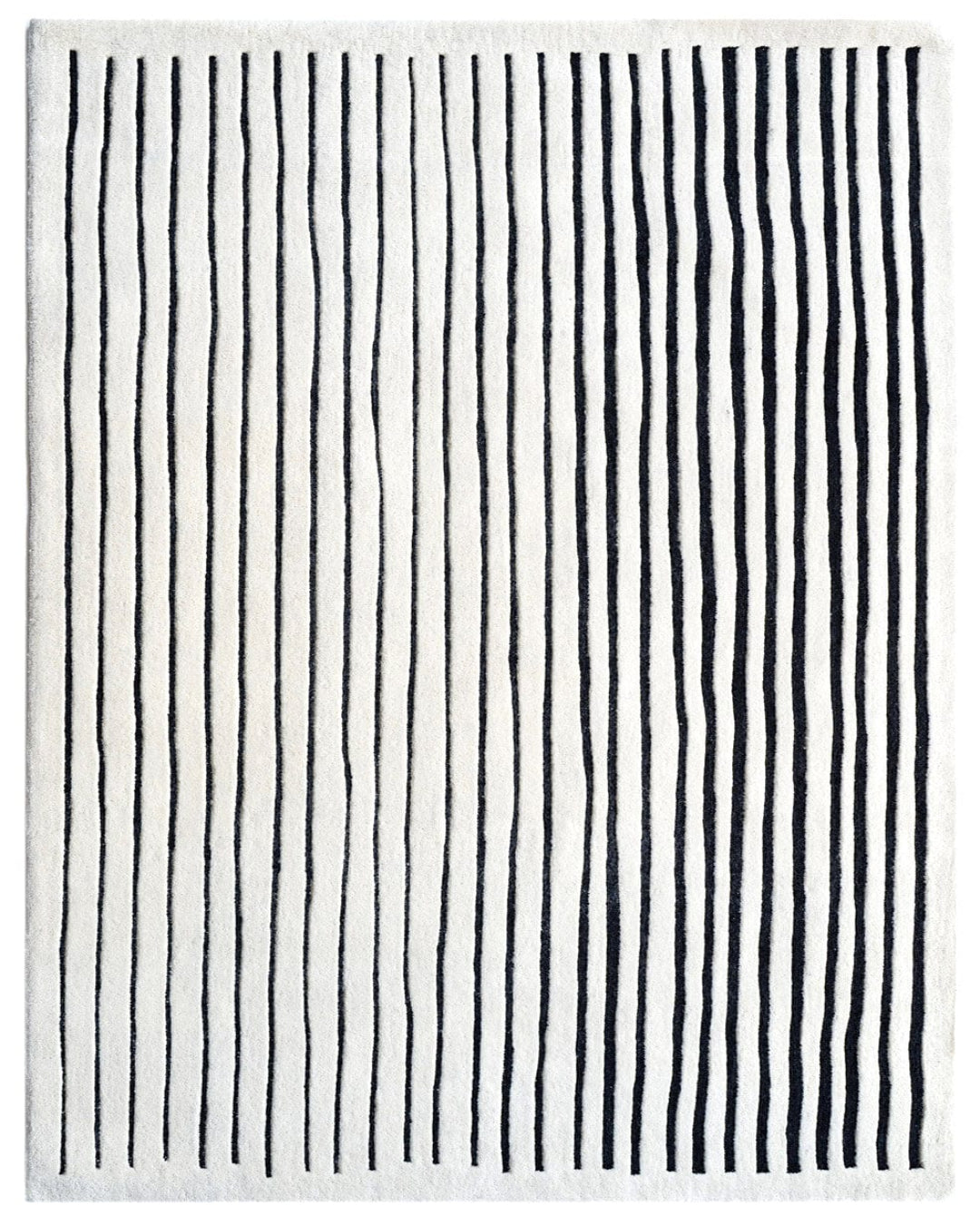 Striped black and white rug with vertical lines on a white background