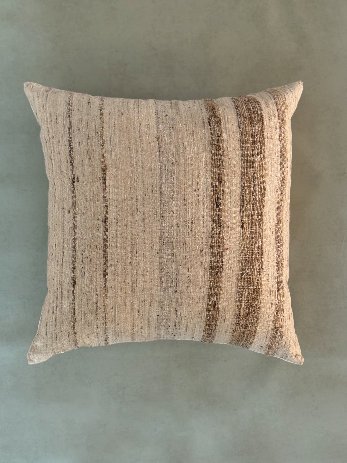 Textured pillow on a solid background