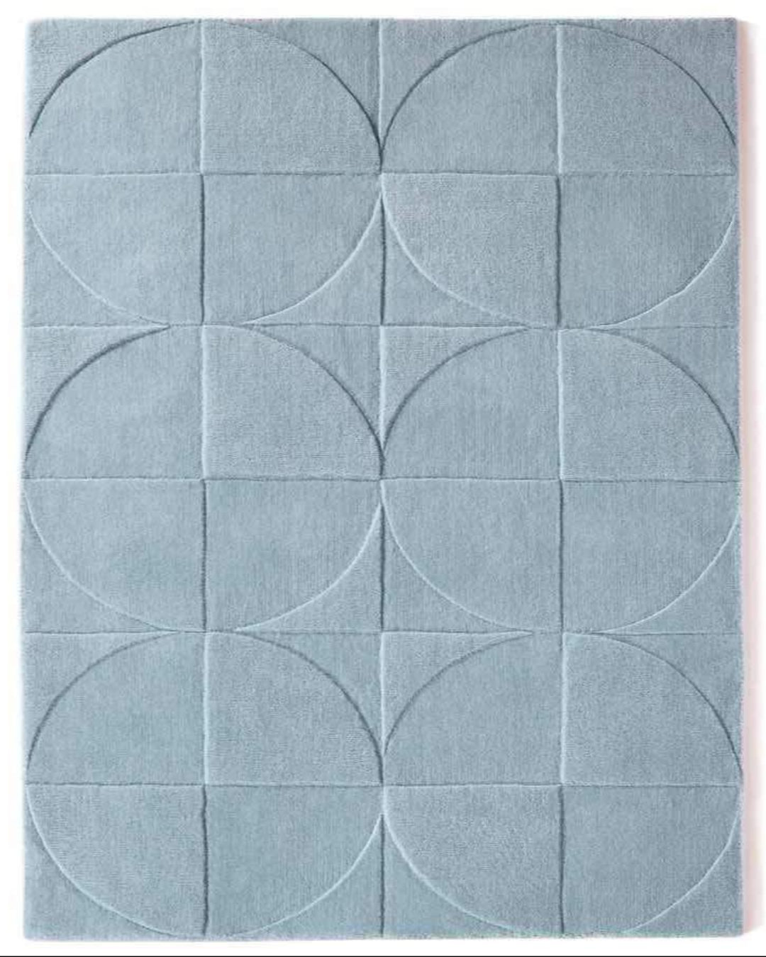 Blue geometric patterned rug with circular designs