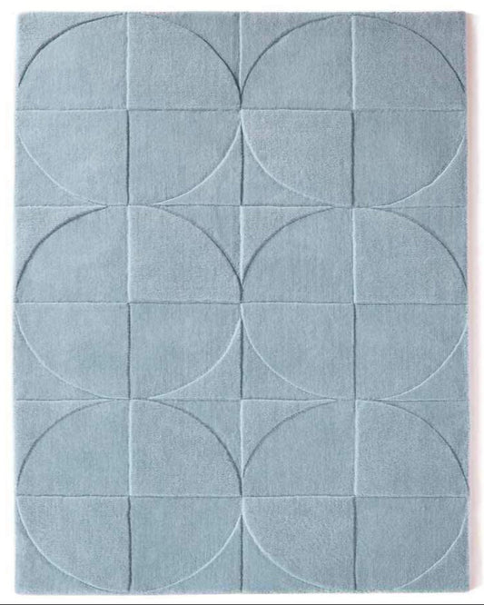 Blue geometric patterned rug with circular designs