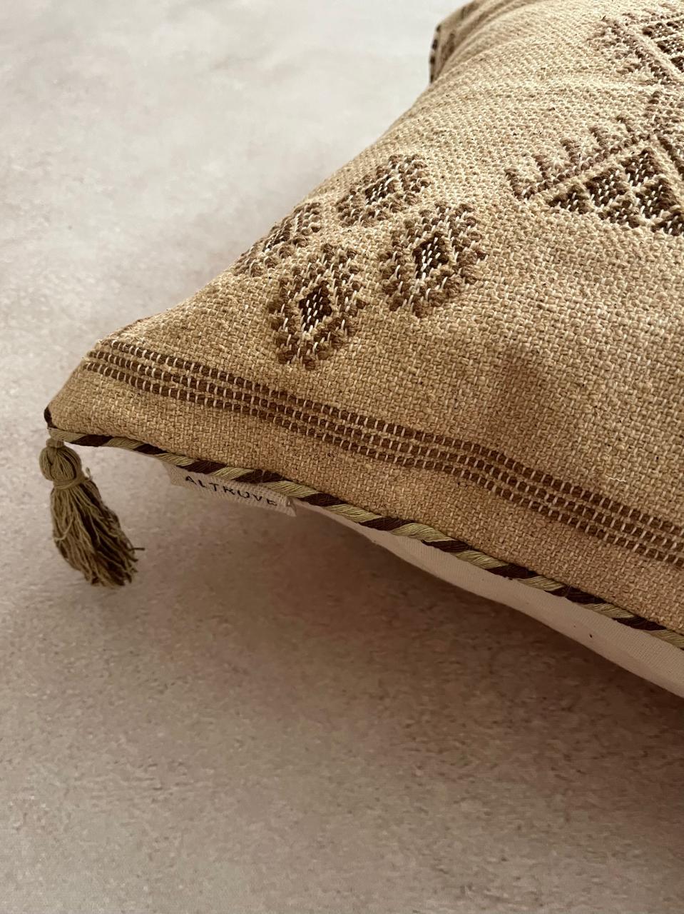 Brown cushion cover with tassels