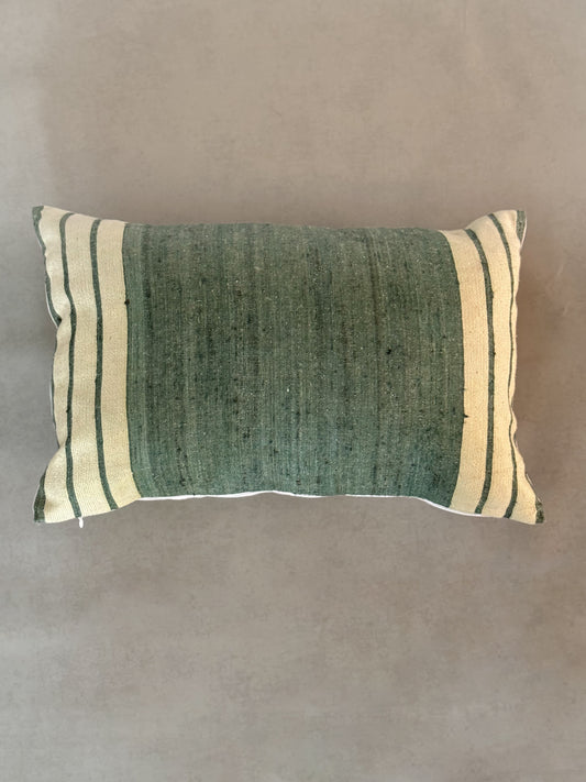 striped pillow on a textured background