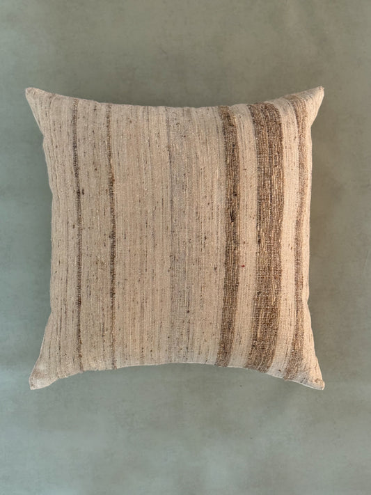 Textured pillow on a solid background