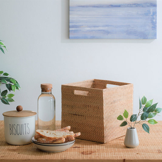 Rattan storage cubby, Woven kitchen storage basket, Natural fiber cube bin, Handwoven rattan organizer, Eco-friendly storage solution, Square wicker basket, Rustic pantry storage basket, Decorative woven cube, Rattan cubby with handles, Minimalist natural storage, Handwoven rattan storage basket for kitchen, Natural wicker cube bin for pantry organization, Stylish storage cubby for shelves or countertops, Eco-conscious woven basket for home storage. 