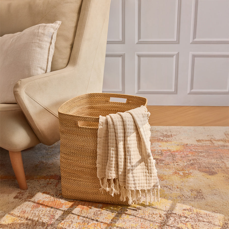 Storage basket for throws and pillows, Decorative woven floor basket, Earthy toned storage solution, 
Textured storage bin for living space, 
Seagrass style woven organizer, 
Functional and stylish storage basket. 