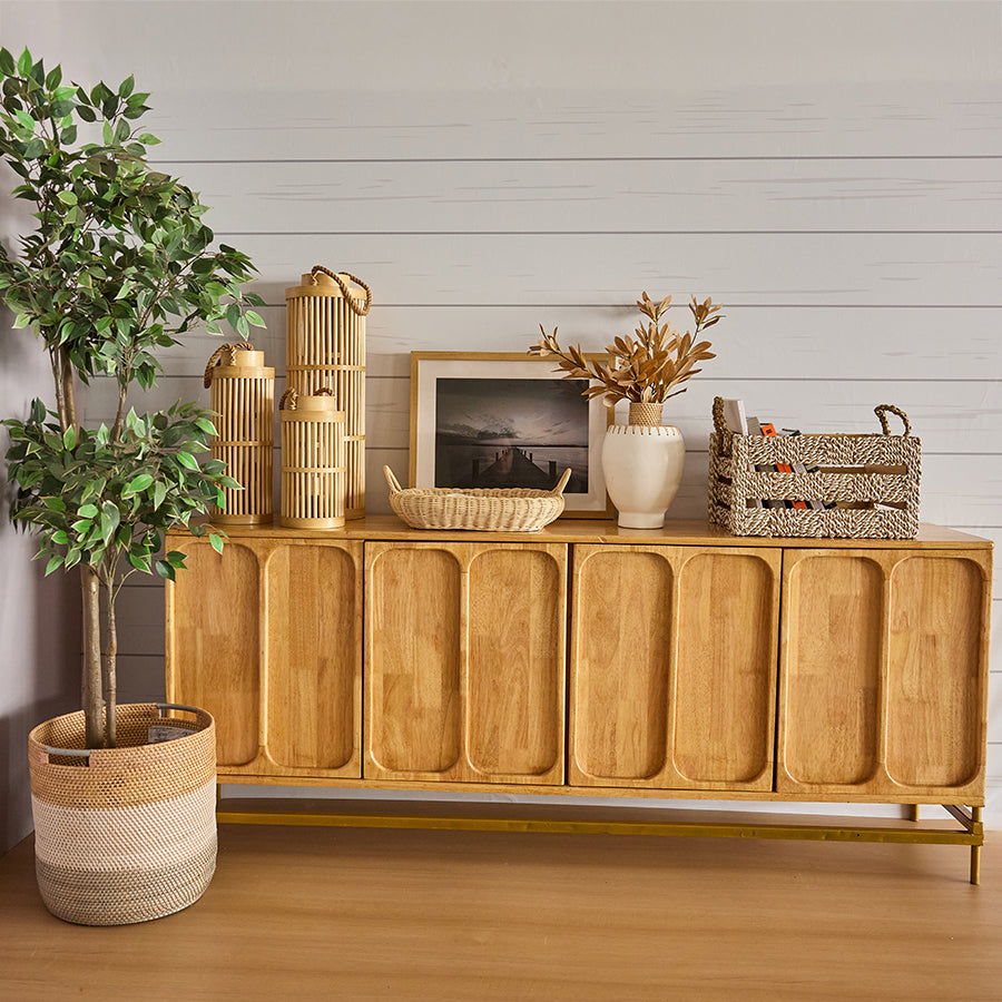 Woven rope storage bin, Handcrafted rope and wood crate, Tall bamboo lantern, Natural rattan candle holder, Artificial indoor tree, Faux potted plant décor, White ceramic vase, 
Minimalist decorative vase.