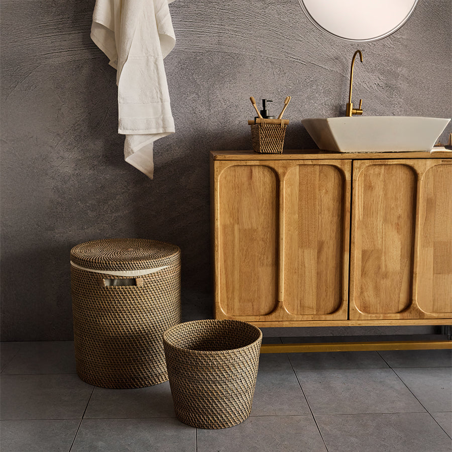 Rattan bathroom basket set, Woven laundry hamper with lid, Wicker waste bin for bathroom, Handwoven bathroom accessories, Natural rattan bathroom organizer, Decorative wicker bathroom décor, Eco-friendly bathroom storage set, Round rattan laundry basket, Woven trash bin for modern bathroom, Sustainable bathroom essentials. 

