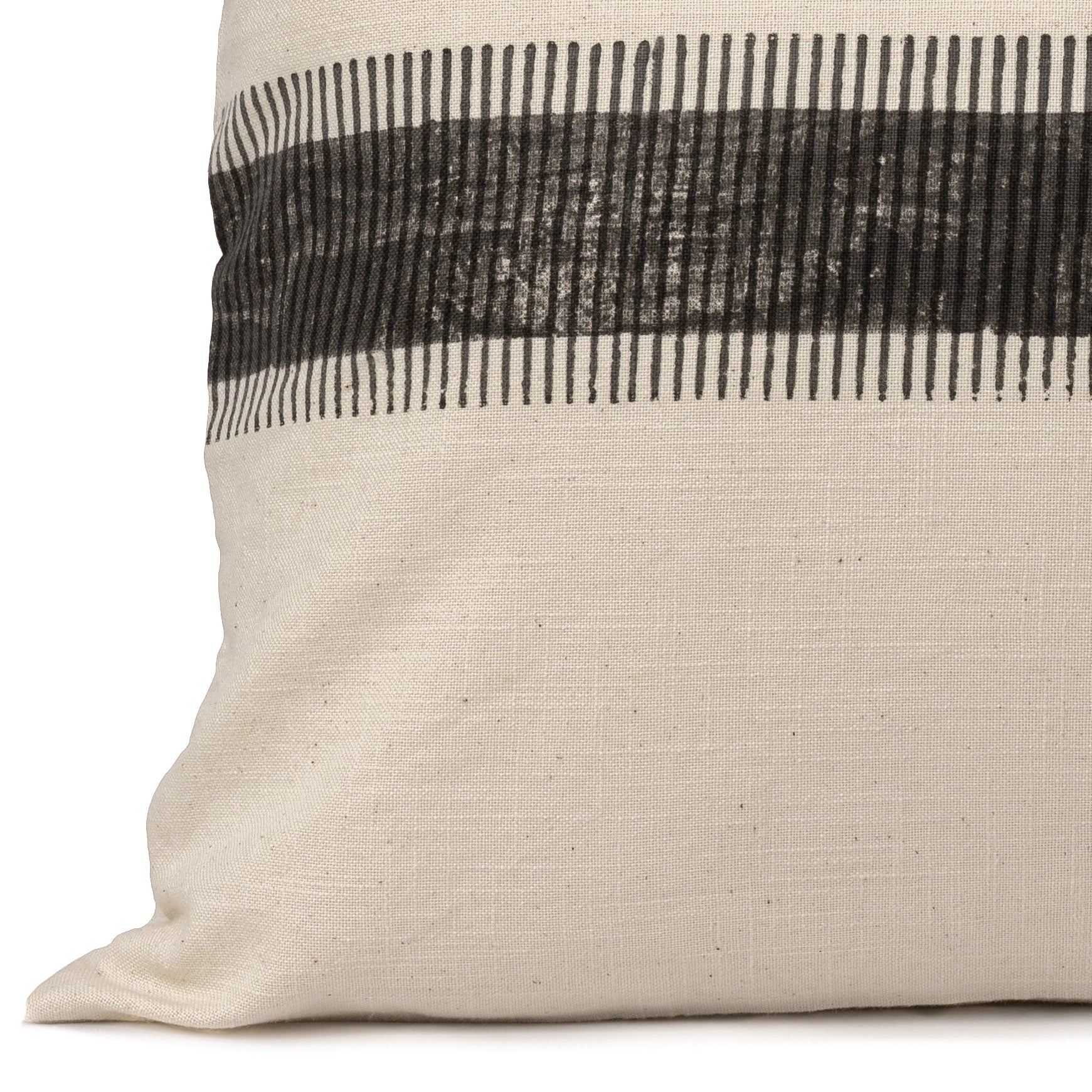Close up of the charcoal block printed design that runs across the lumbar cotton cushion cover